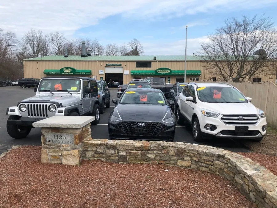 Pre-owned cars lined up in front of the Auto Tec building at 1125 Bedford St