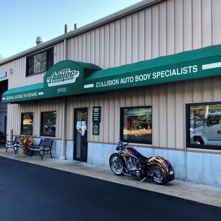 The Auto Tec storefront with a custom motorcycle parked out front
